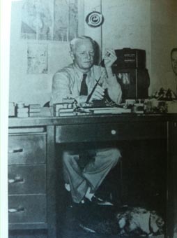 Nimitz at desk